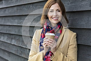 Happy Attractive Middle Aged Woman Drinking Coffee