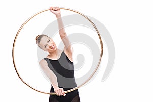 Happy attractive rhythmic gymnast in black leotard holding hoop