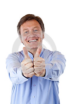 Happy, attractive senior man shows both thumbs