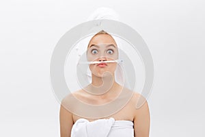 Happy attractive woman playing with tooth brush on copy space, isolated on white