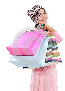 Happy of attractive young muslim woman with shopping bag
