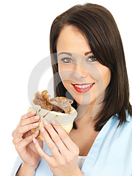 Happy Attractive Young Woman Eating a Donner Kebab