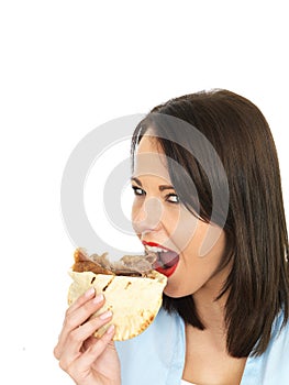 Happy Attractive Young Woman Eating a Donner Kebab