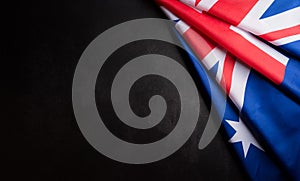 Happy Australia day concept. Australian flag against dark stone background. 26 January