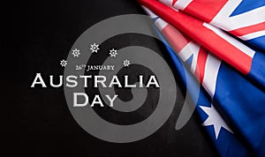 Happy Australia day concept. Australian flag against dark stone background. 26 January