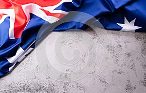 Happy Australia day concept. Australian flag against stone background. 26 January