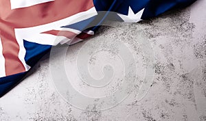 Happy Australia day concept. Australian flag against stone background. 26 January