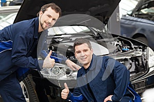 Happy auto mechanics.