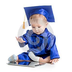 Happy baby in academician clothes with laptop