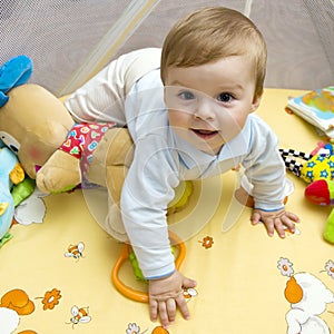 Happy baby on bed photo