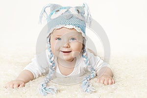 Happy Baby in Blue Knitted Hat, Smiling Kid Boy Raising Head