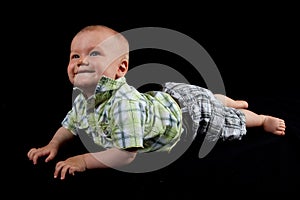 Happy Baby Boy on a Black Background