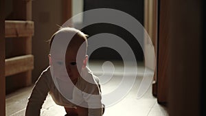 happy baby boy crawling on floor toddler exploring home curious infant having fun enjoying childhood. Little Cute