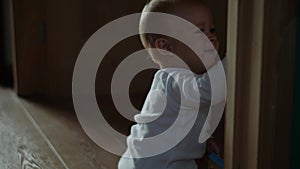 happy baby boy crawling on floor toddler exploring home curious infant having fun enjoying childhood. Little Cute