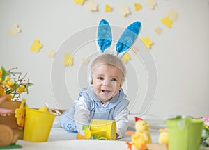 Happy baby boy with Easter bunny ears