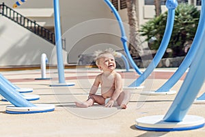 Happy baby boy enjoying playground