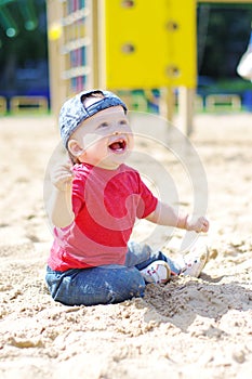 Happy baby boy on playground