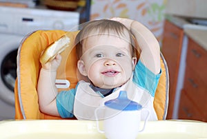 Happy baby boy with round cracknel photo