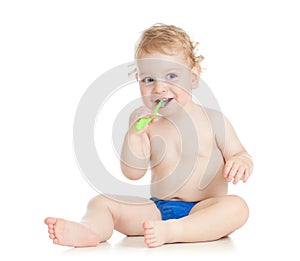 Happy baby child brushing teeth