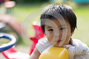 Happy baby child at the playground.