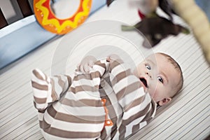 Happy baby in crib photo