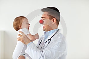 Happy baby at doctor on red nose day