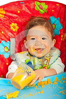 Happy baby eating puree