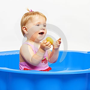 Happy baby girl in bathtube