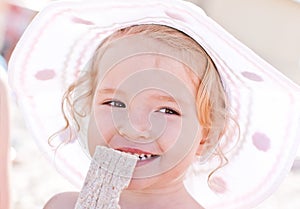 Happy baby girl on the beach