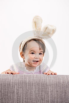 Happy baby girl in easter costume