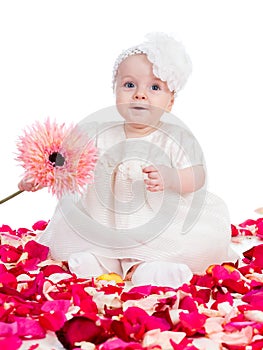 Happy baby girl with flower