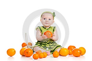 Happy baby girl with fruits