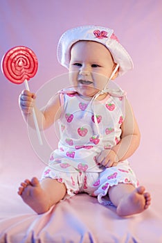 Happy baby girl lollipop