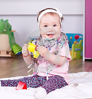 Happy baby girl playing