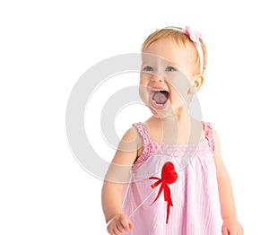 Happy baby girl with red heart isolated