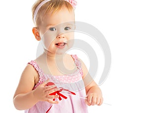 Happy baby girl with red heart isolated