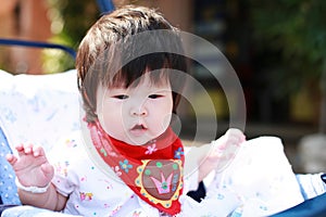 Happy baby girl in Stroller