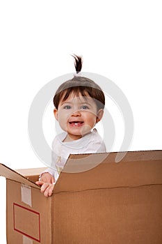 Happy baby in moving box