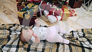 Happy baby near Christmas tree