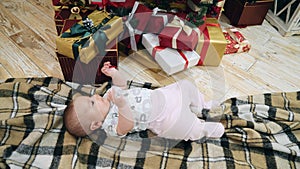 Happy baby near Christmas tree