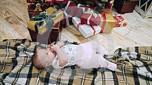 Happy baby near Christmas tree