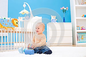 Happy baby playing indoor