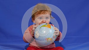 Happy Baby Playing With Terrestrial Globe
