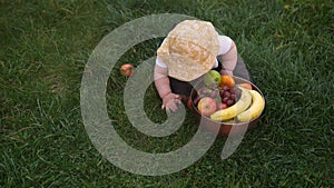 Happy Baby Sitting With Soccer Black White Classic Ball On Green Grass. Adorable Infant Baby Playing Outdoors In