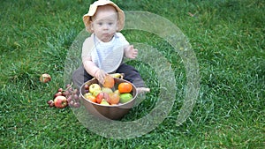 Happy Baby Sitting With Soccer Black White Classic Ball On Green Grass. Adorable Infant Baby Playing Outdoors In