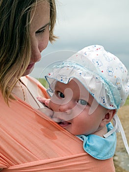 Happy baby in sling