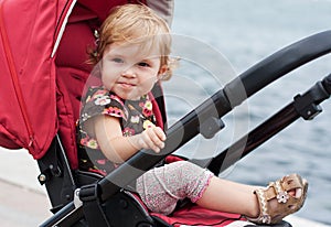 Happy baby in a stroller