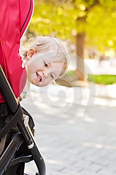 Happy baby in a stroller