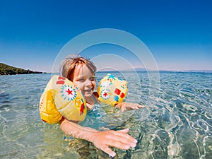 Happy baby swimming