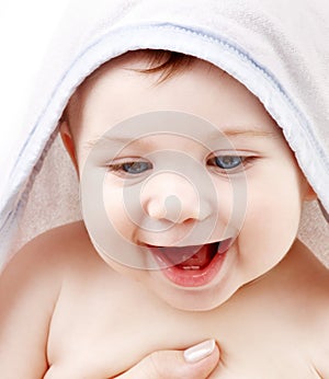 Happy baby with terry hoodie robe on head